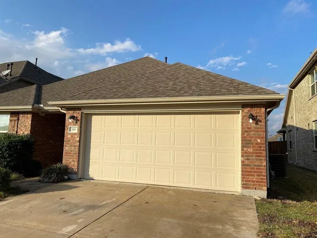 a view of a house with a garage