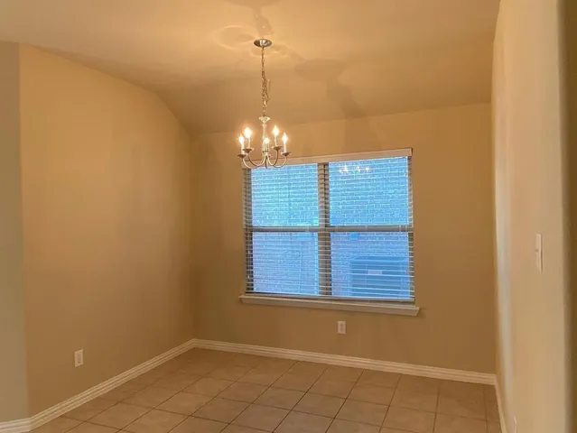 a view of a room that has a window in it