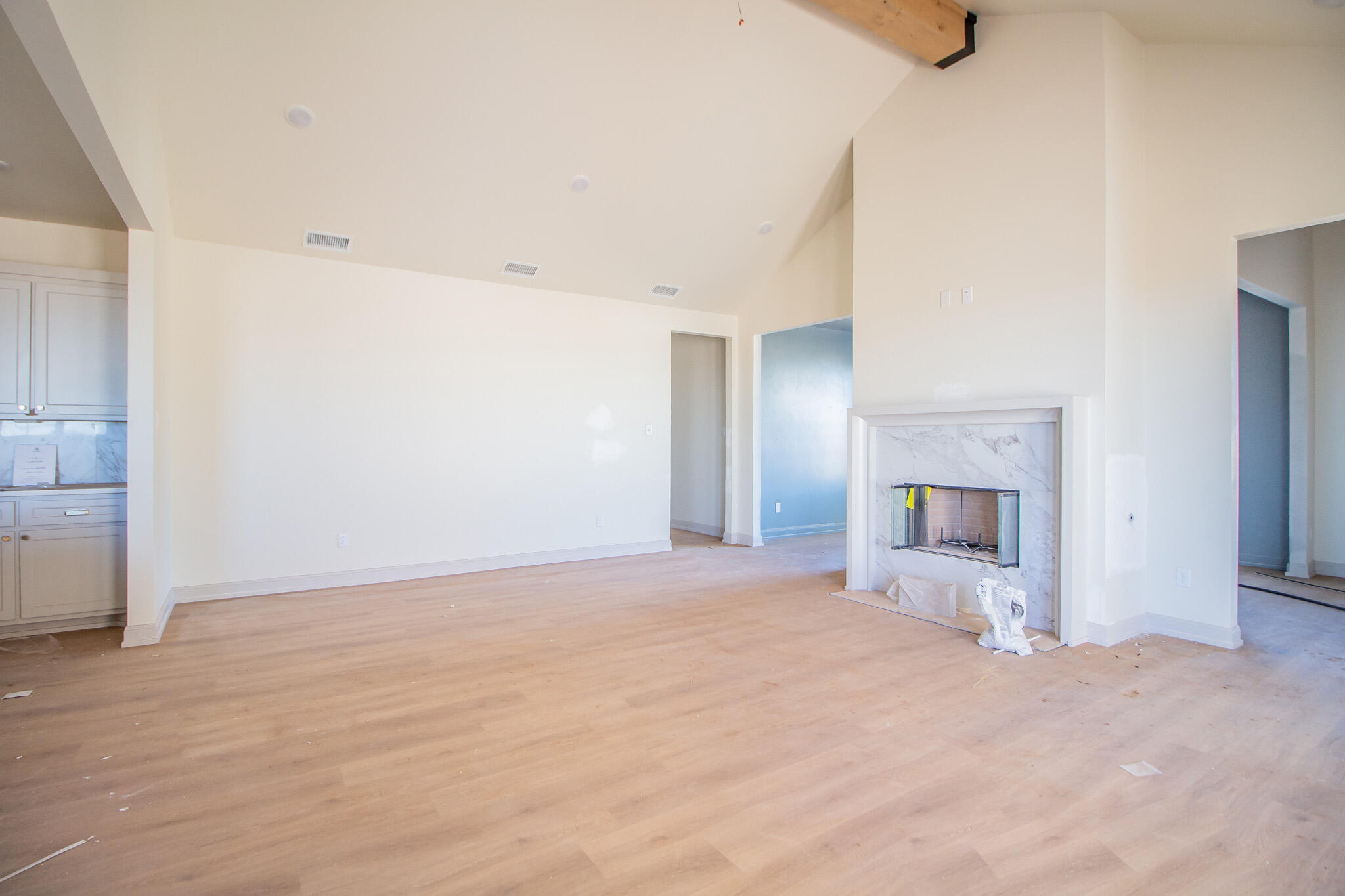 1011 County Road 7715 Lubbock, TX 79423 - Photo 16 of 20 a view of an empty room with a fireplace