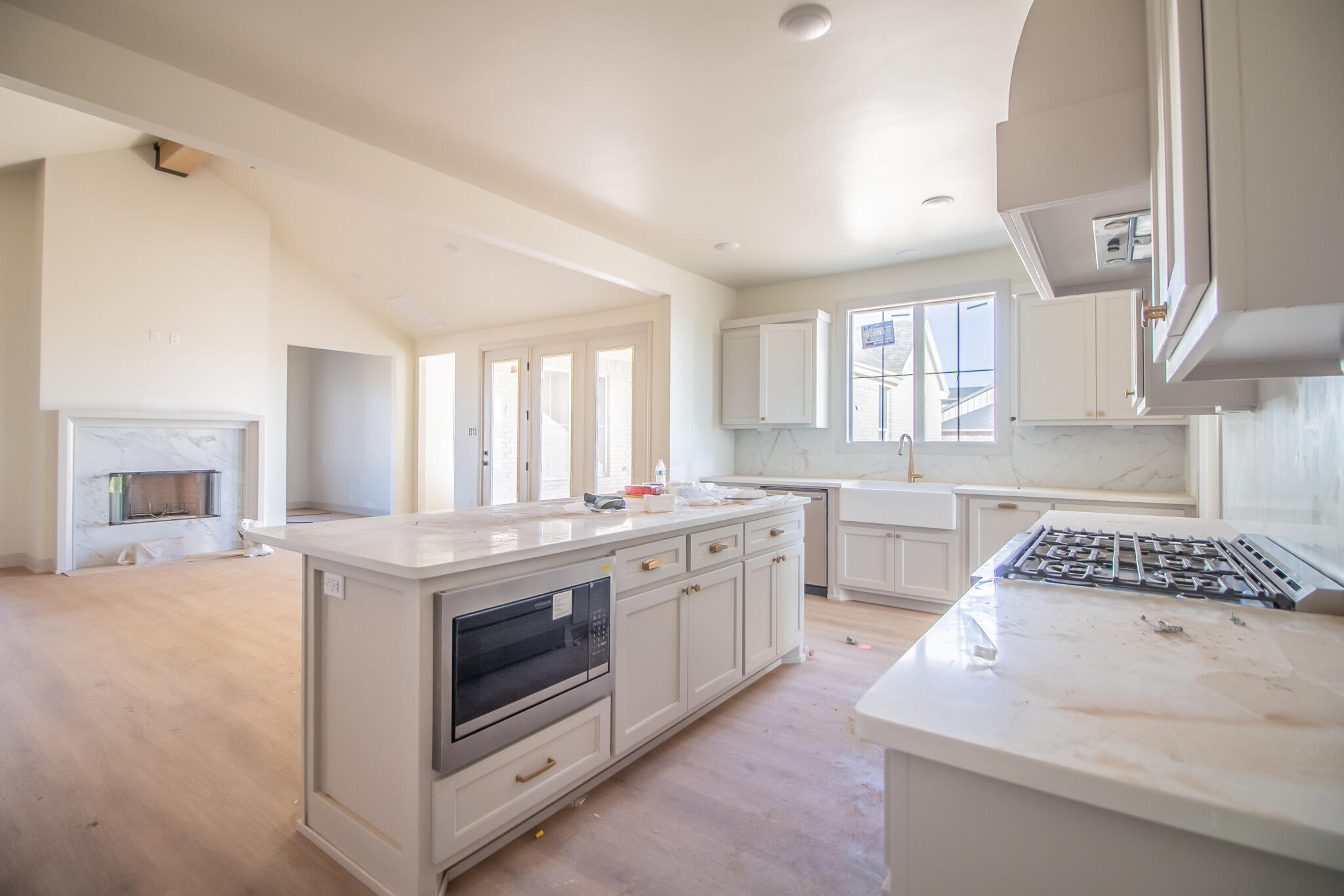 1011 County Road 7715 Lubbock, TX 79423 - Photo 5 of 20 a kitchen with a stove and white cabinets