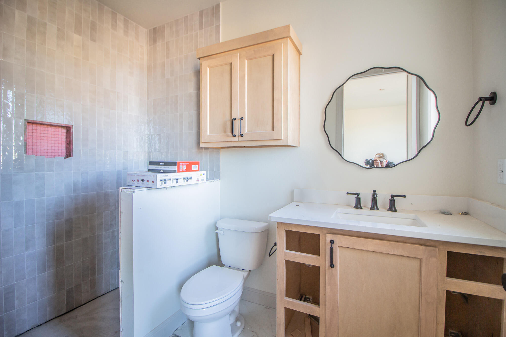 1011 County Road 7715 Lubbock, TX 79423 - Photo 7 of 20 a bathroom with a toilet sink vanity and mirror