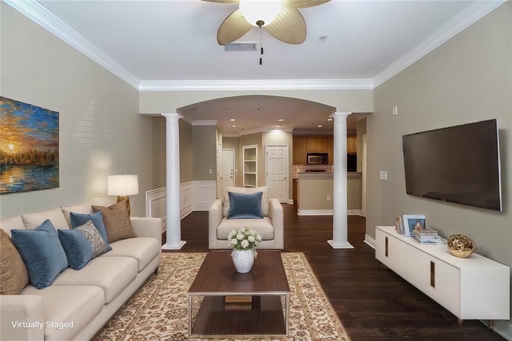 a living room with furniture and a flat screen tv