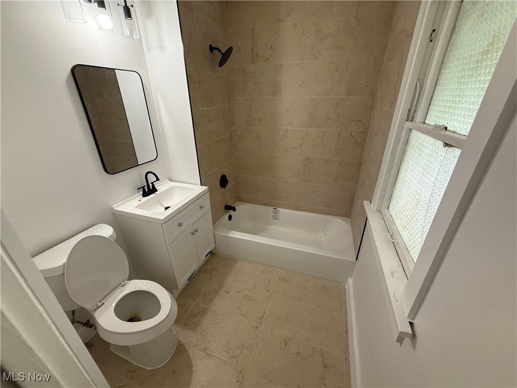 1058 Pembrook Road Cleveland Heights, OH 44121 - Photo 38 of 39 Bathroom with shower / bathtub combination, vanity, and light tile patterned floors