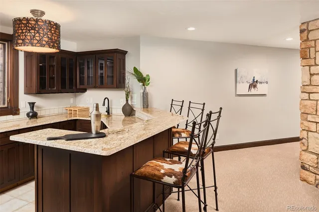 a bedroom with a bed and a lamp