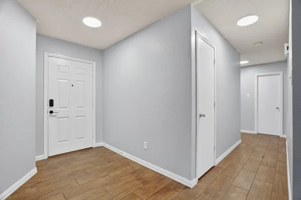 a view of a hallway with closet
