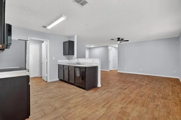 a view of a kitchen with a sink