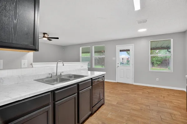 a kitchen with a sink and a window