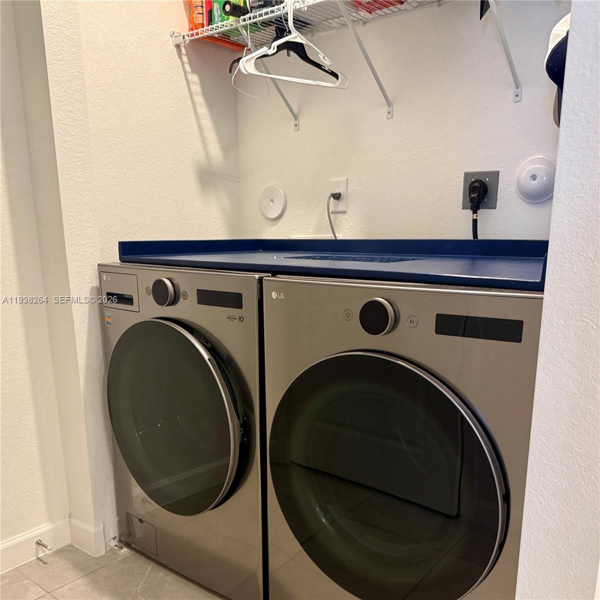 23049 Southwest 129th Place Miami, FL 33177 - Photo 11 of 29 a utility room with dryer and washer