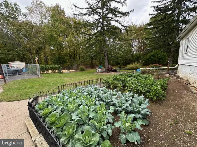a view of a two chair and a table in the balcony