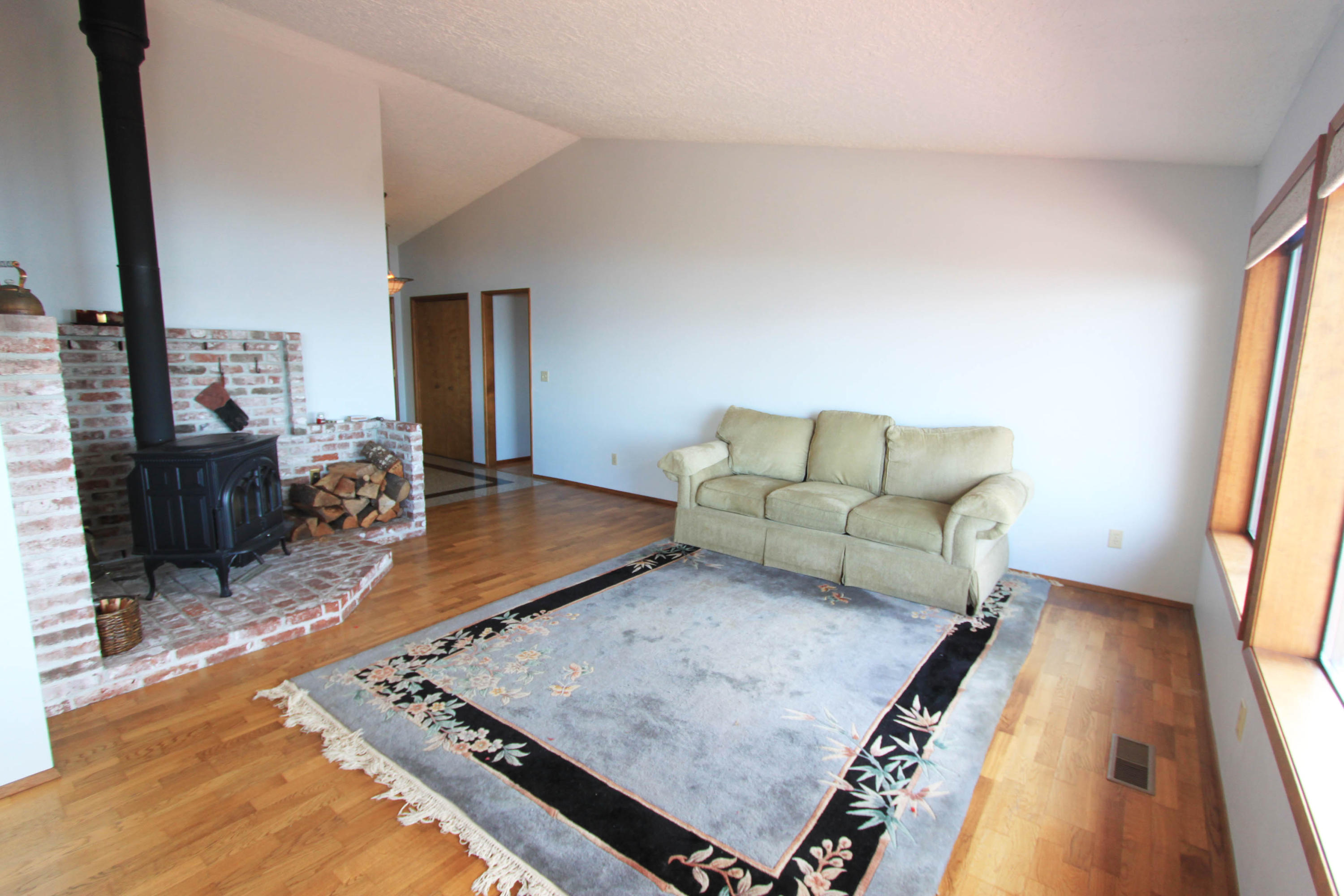 3305 Netarts Bay Road Tillamook, OR 97141 - Photo 5 of 26 living room with woodstove