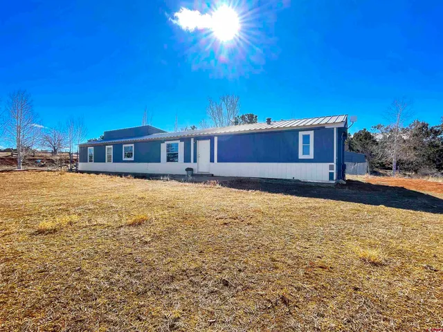 a view of an ocean & house