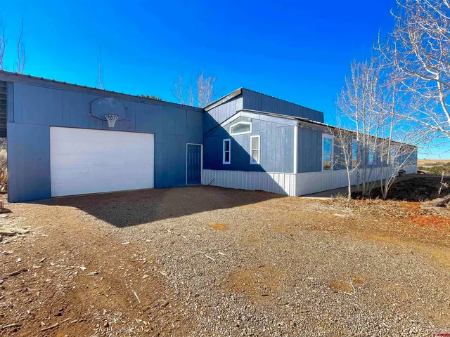 a view of living room with furniture and a window