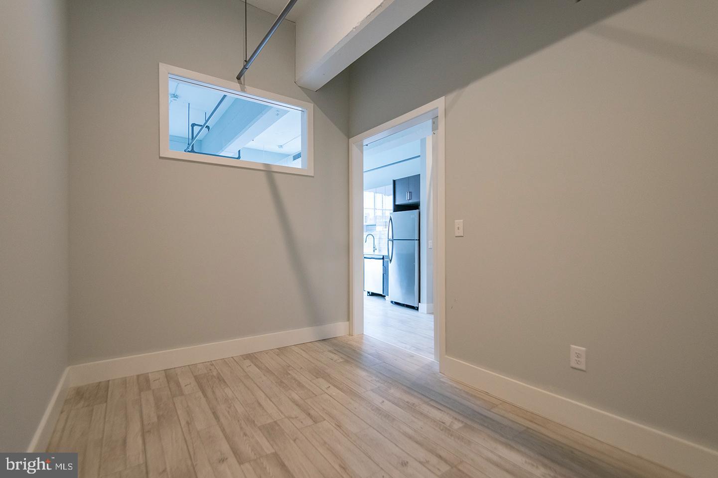 412 South 13th Street, Unit 307 Philadelphia, PA 19147 - Photo 6 of 16 a view of an empty room with wooden floor