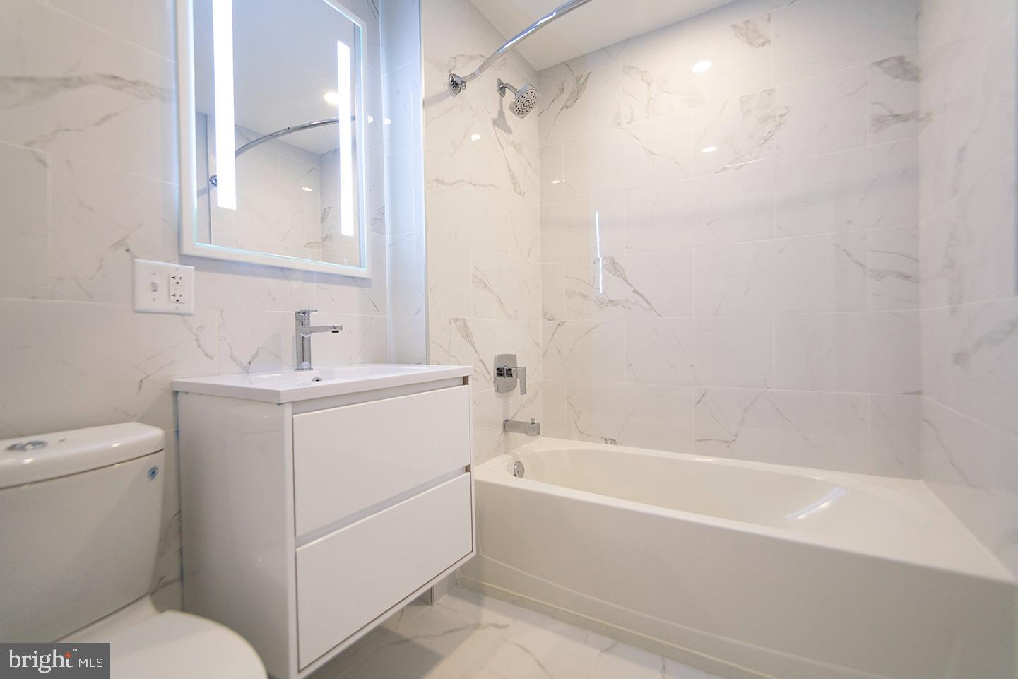 412 South 13th Street, Unit 307 Philadelphia, PA 19147 - Photo 8 of 16 a bathroom with a sink a toilet and shower