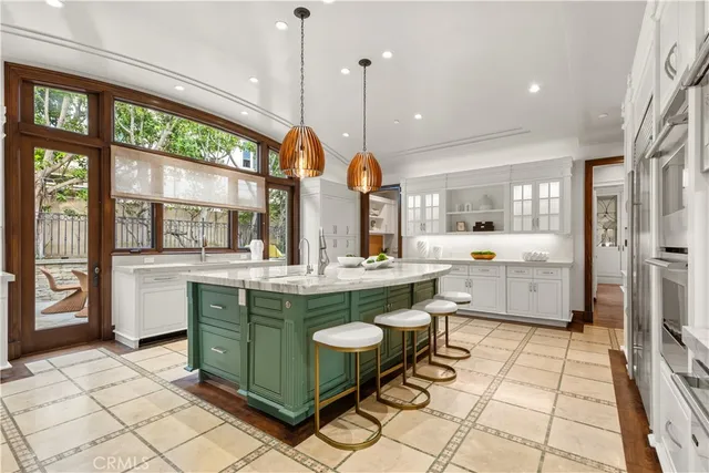 a room with lots of counter and windows