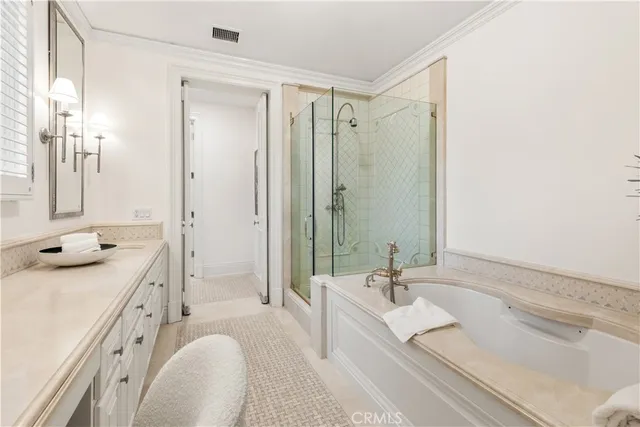 a bathroom with a tub sink double and mirror