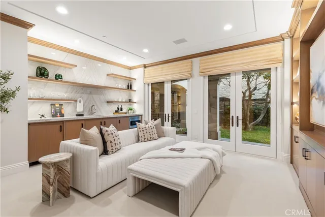 a bedroom with furniture and a large window