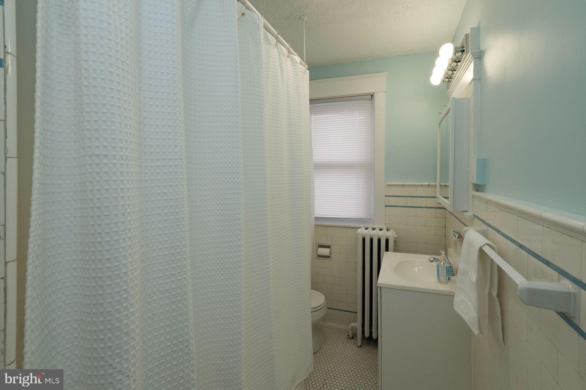 41 North Carroll Street Reading, PA 19611 - Photo 17 of 33 a bathroom with a sink and mirror