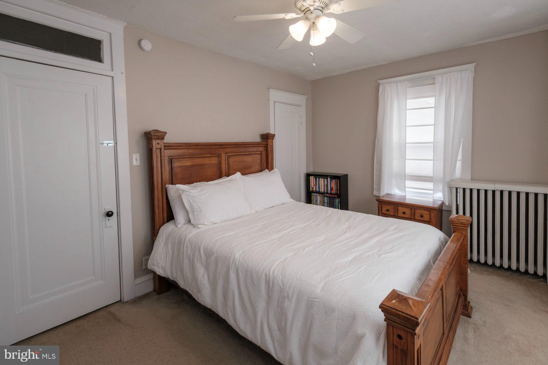 41 North Carroll Street Reading, PA 19611 - Photo 20 of 33 a bedroom with a bed and a chandelier