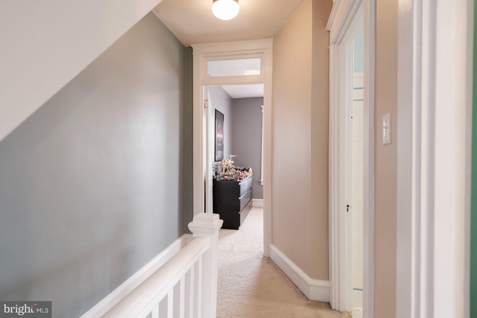 41 North Carroll Street Reading, PA 19611 - Photo 32 of 33 a view of a hallway with wooden floor and a bathroom