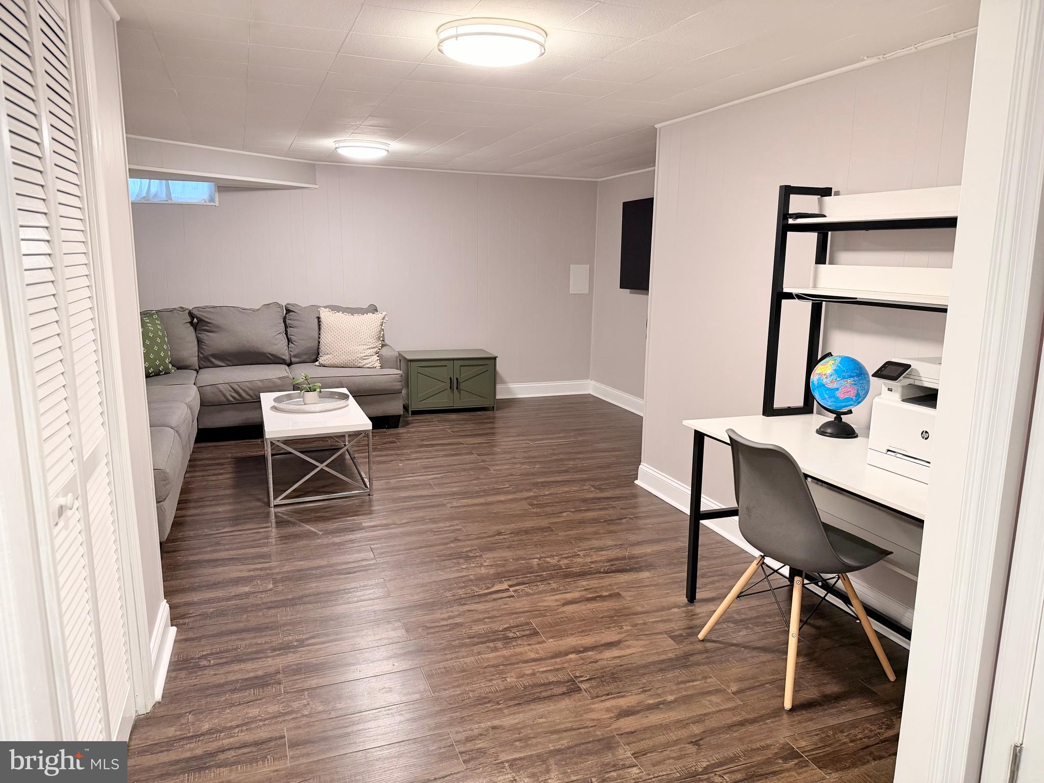 2235 Southorn Road Baltimore, MD 21220 - Photo 23 of 33 a living room with furniture and a wooden floor