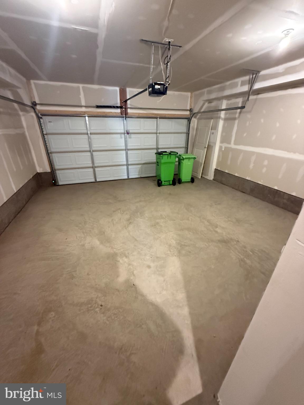 2108 Acadia Road Herndon, VA 20170 - Photo 21 of 21 Spacious garage with clean, unfinished walls.