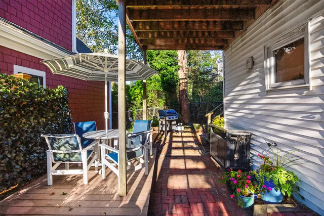 a view of a chairs and table in the patio