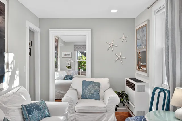 a living room with furniture and a window