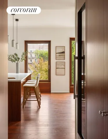 a view of a livingroom with furniture and hardwood floor
