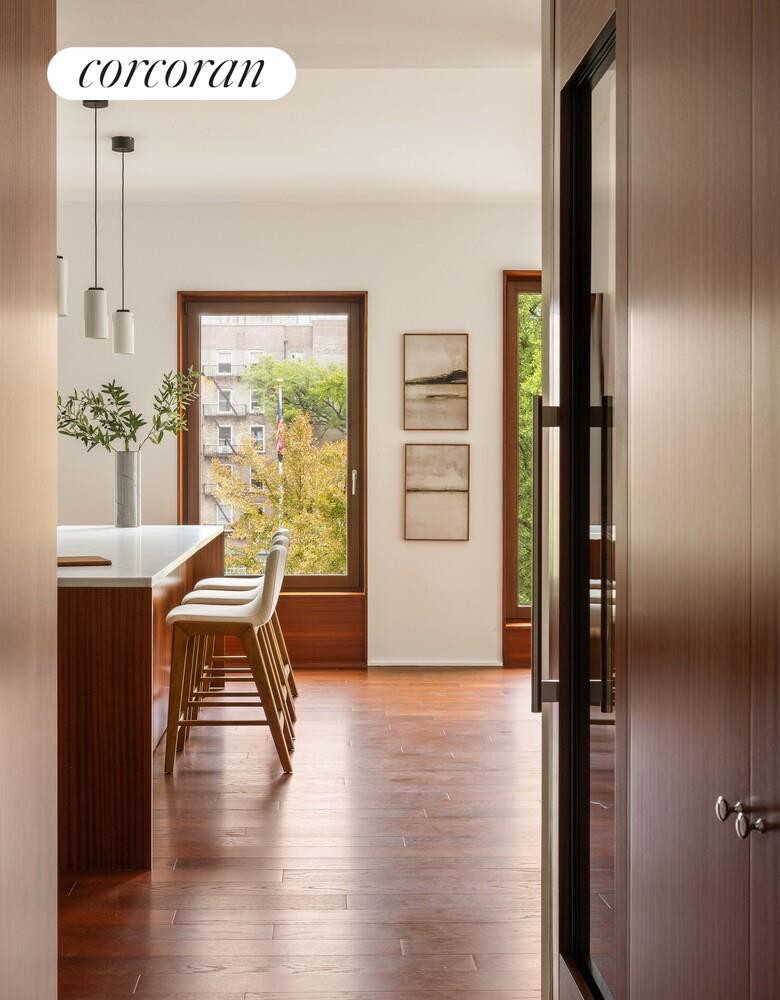 83 Thompson Street, Unit 5 Manhattan, NY 10012 - Photo 12 of 31 a view of a livingroom with furniture window and wooden floor