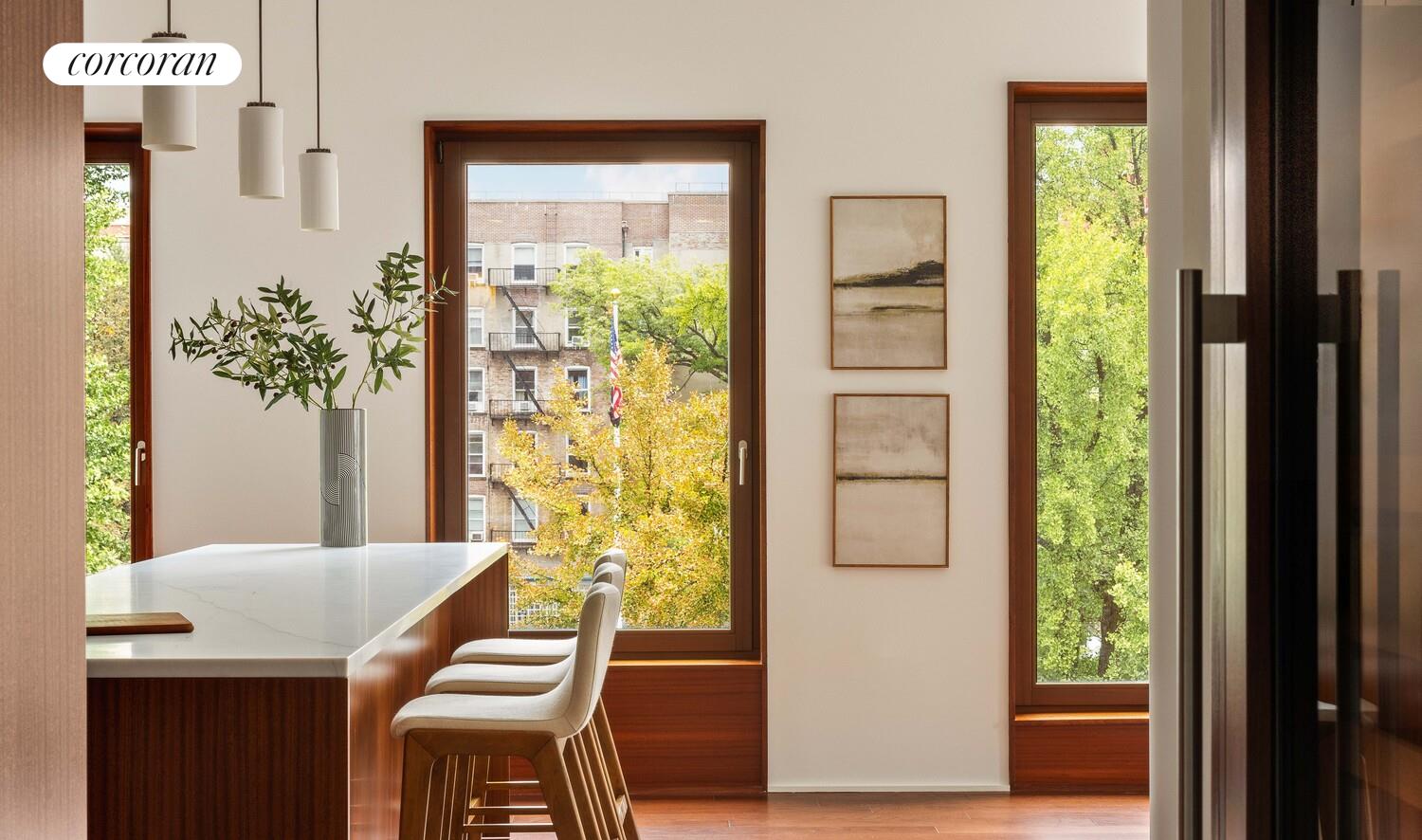 83 Thompson Street, Unit 5 Manhattan, NY 10012 - Photo 13 of 31 a room with a table and a chair