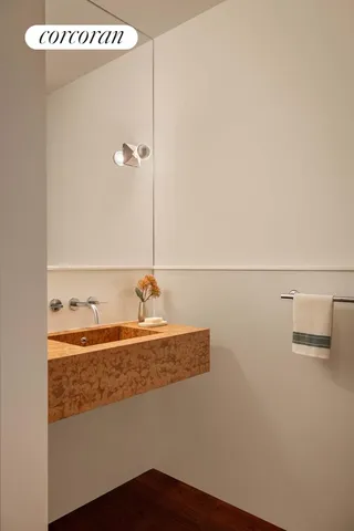 a kitchen with kitchen island granite countertop a refrigerator and a stove top oven