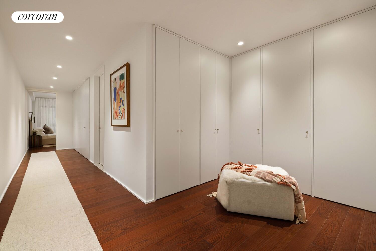 83 Thompson Street, Unit 5 Manhattan, NY 10012 - Photo 19 of 31 a hallway with a couch and a potted plant