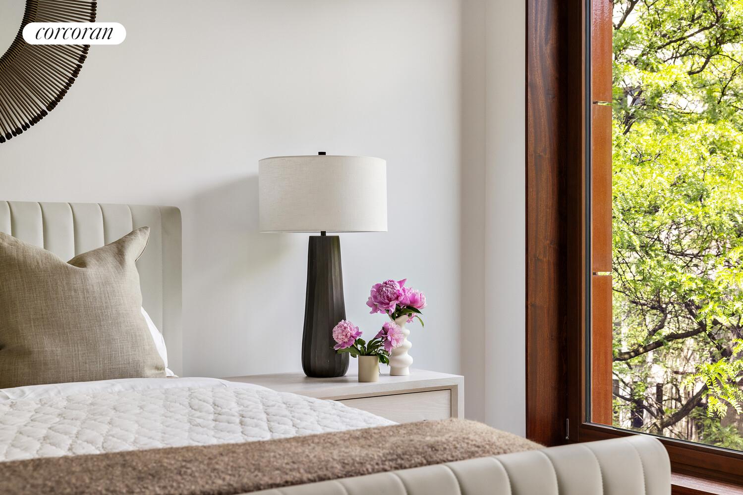 83 Thompson Street, Unit 5 Manhattan, NY 10012 - Photo 22 of 31 a bedroom with a bed and a potted plant