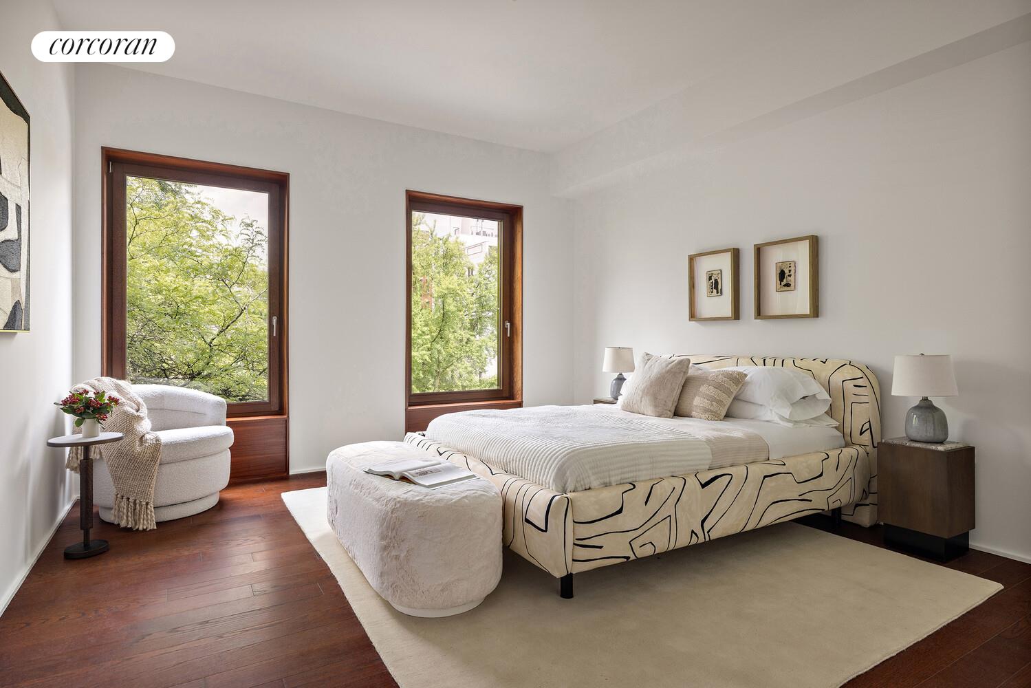 83 Thompson Street, Unit 5 Manhattan, NY 10012 - Photo 24 of 31 a bedroom with a bed and a couch