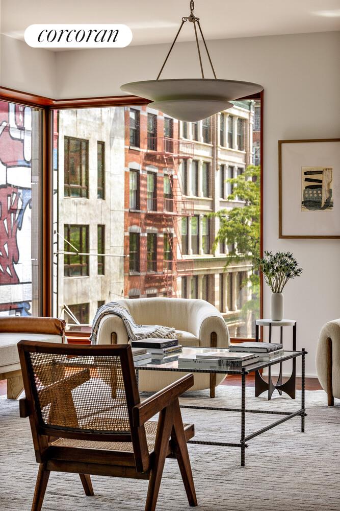 83 Thompson Street, Unit 5 Manhattan, NY 10012 - Photo 3 of 31 a workspace with furniture and window