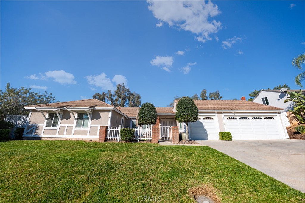 10451 Morning Ridge Drive Moreno Valley, CA 92557 - Photo 12 of 56 a view of a house with garden and a sitting area