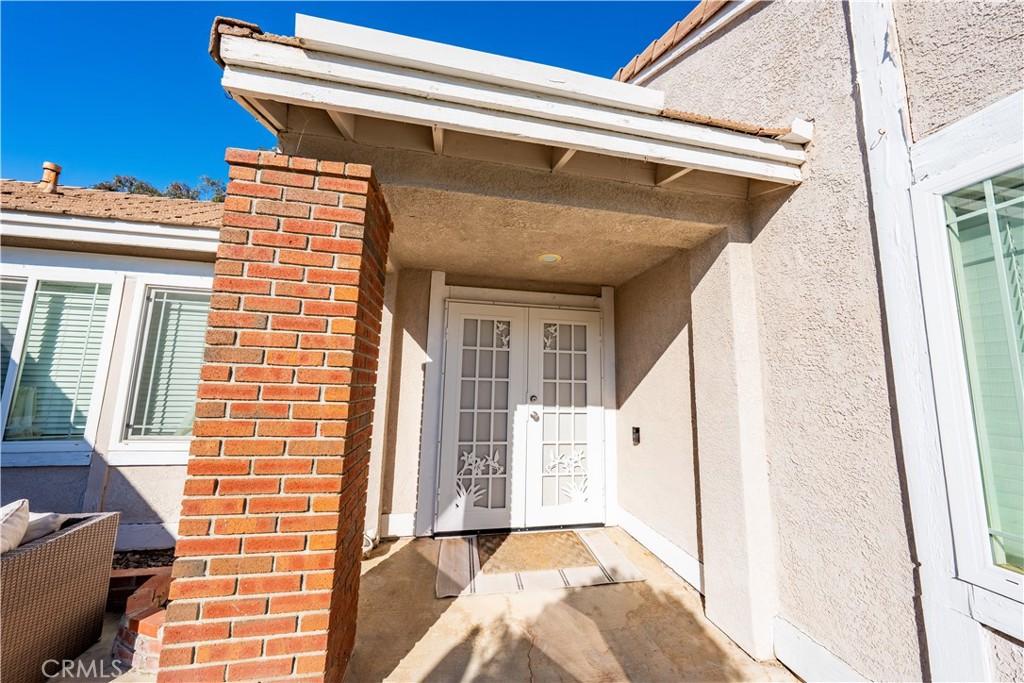 10451 Morning Ridge Drive Moreno Valley, CA 92557 - Photo 14 of 56 a front view of a house with wooden floor