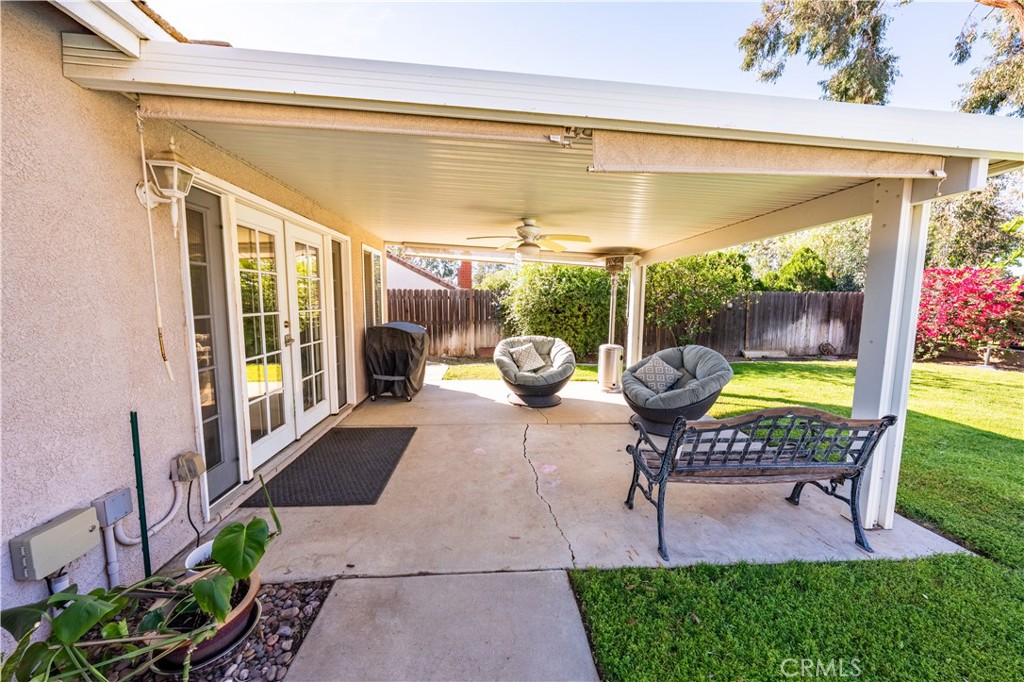 10451 Morning Ridge Drive Moreno Valley, CA 92557 - Photo 15 of 56 a view of a swimming pool with chairs in patio
