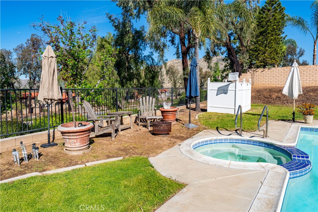 10451 Morning Ridge Drive Moreno Valley, CA 92557 - Photo 22 of 56 a view of a backyard with sitting area and garden