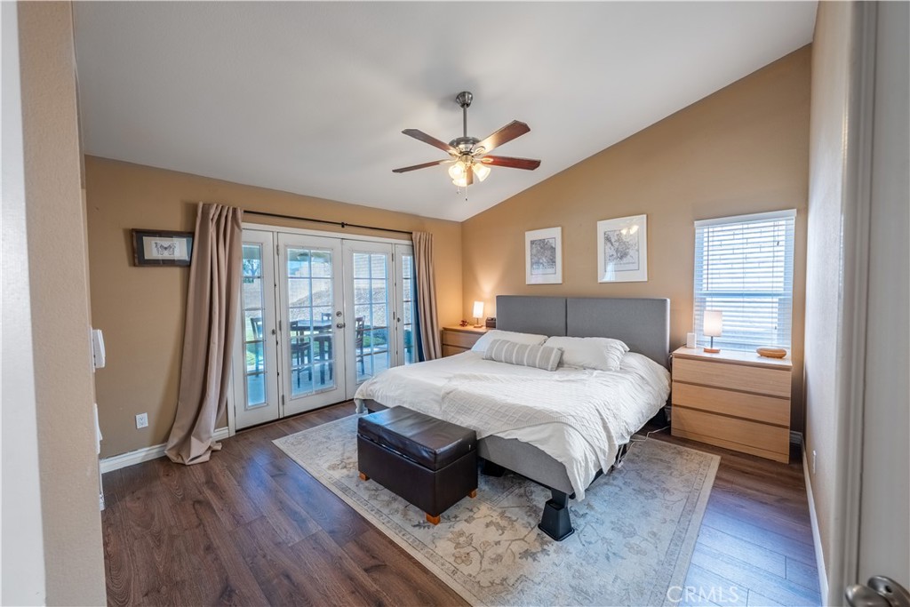 10451 Morning Ridge Drive Moreno Valley, CA 92557 - Photo 26 of 56 a bedroom with a large bed and a large window