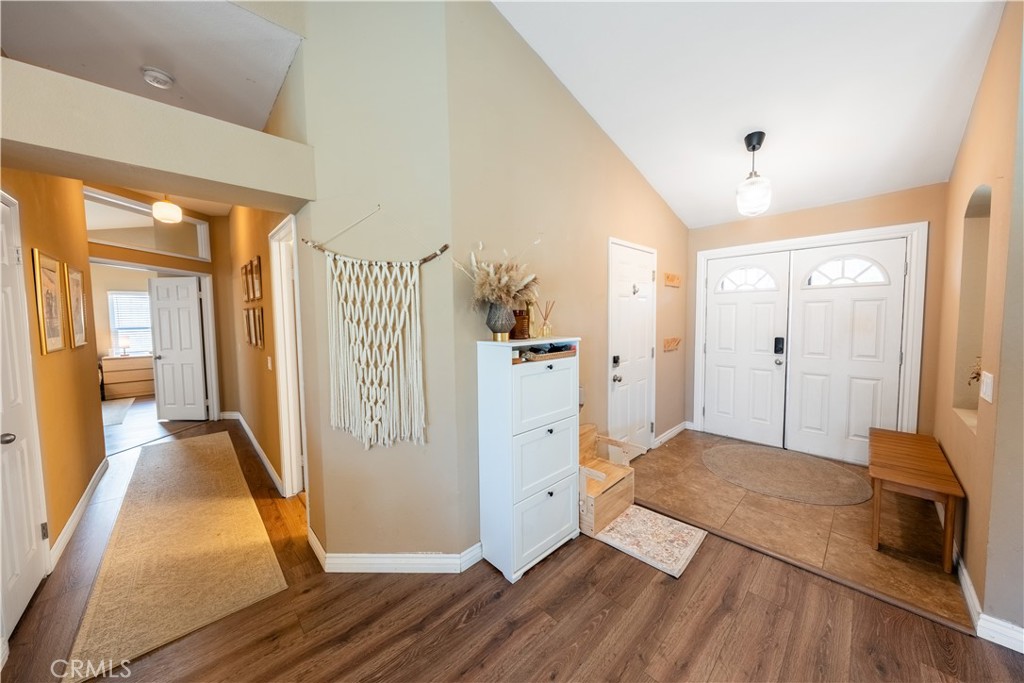 10451 Morning Ridge Drive Moreno Valley, CA 92557 - Photo 36 of 56 a view of a hallway view with wooden floor and a living room