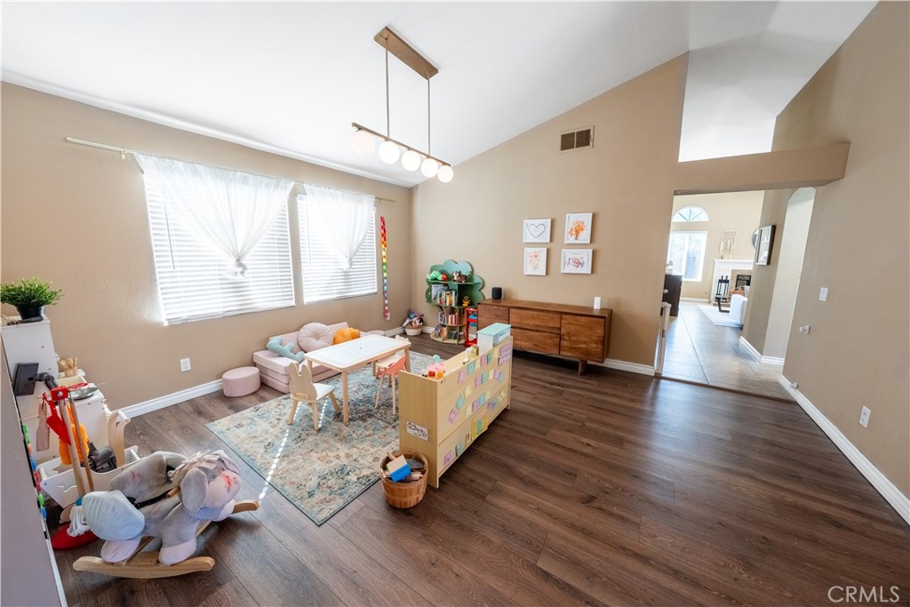 10451 Morning Ridge Drive Moreno Valley, CA 92557 - Photo 40 of 56 a living room with furniture and a wooden floor