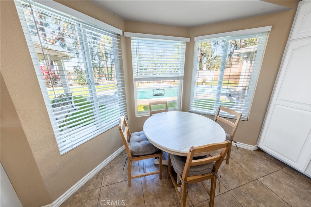 10451 Morning Ridge Drive Moreno Valley, CA 92557 - Photo 43 of 56 a view of a dining room with furniture and wooden floor