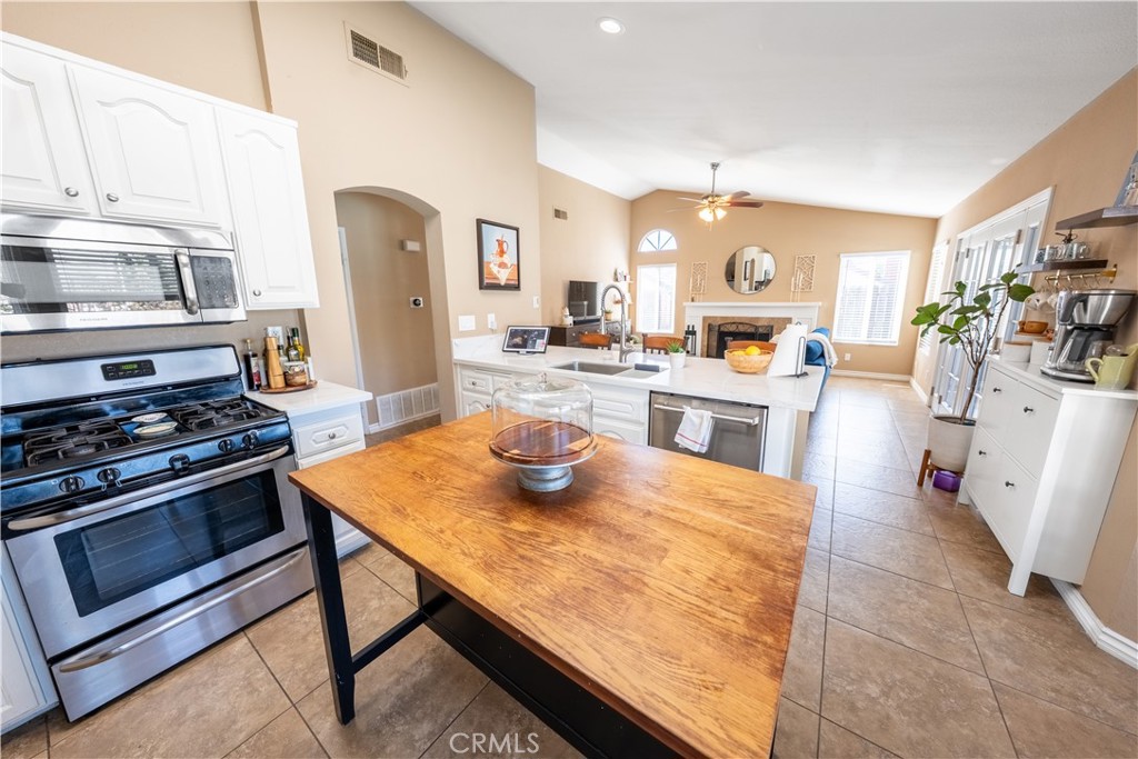 10451 Morning Ridge Drive Moreno Valley, CA 92557 - Photo 45 of 56 a kitchen with sink cabinets and stainless steel appliances