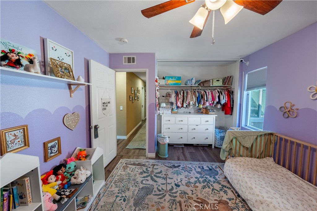 10451 Morning Ridge Drive Moreno Valley, CA 92557 - Photo 54 of 56 a bedroom with furniture and a couch