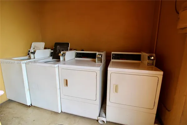 a utility room with dryer and washer