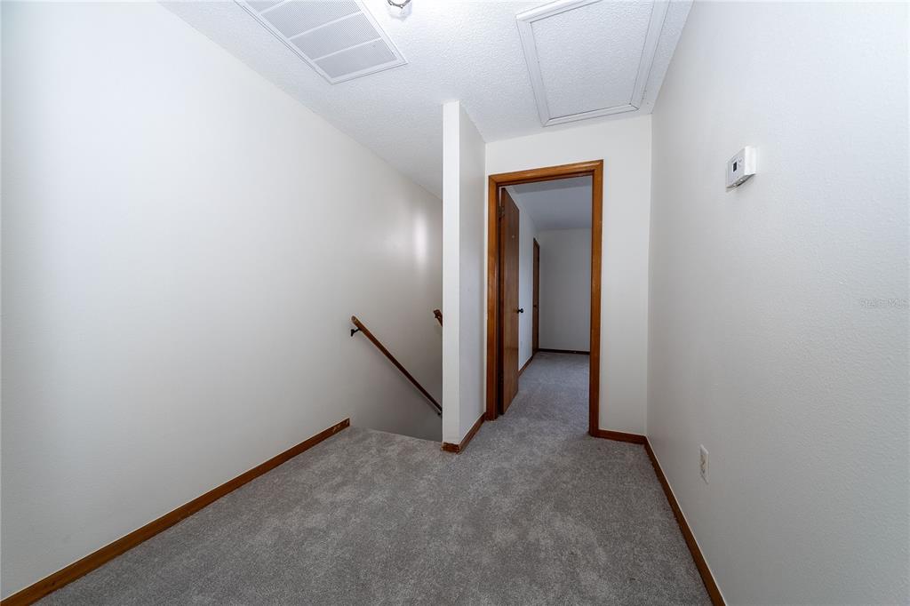8557 Pilgrim Court New Port Richey, FL 34653 - Photo 17 of 29 a view of a hallway with closet
