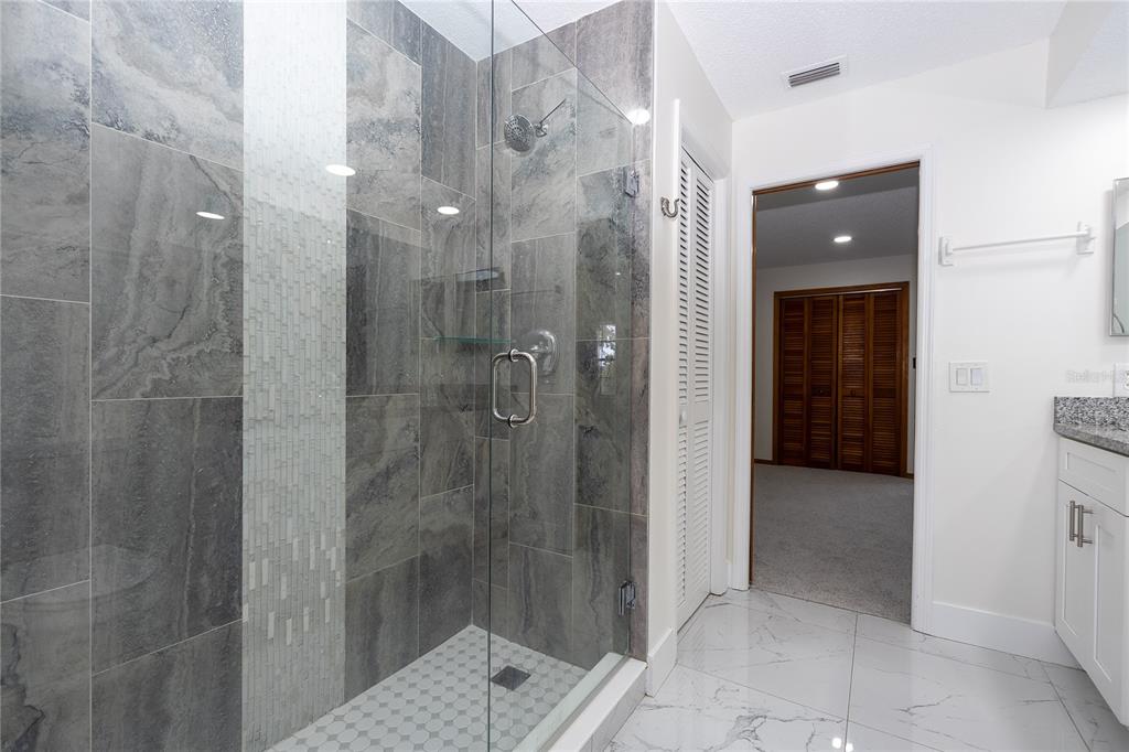 8557 Pilgrim Court New Port Richey, FL 34653 - Photo 23 of 29 a bathroom with a shower