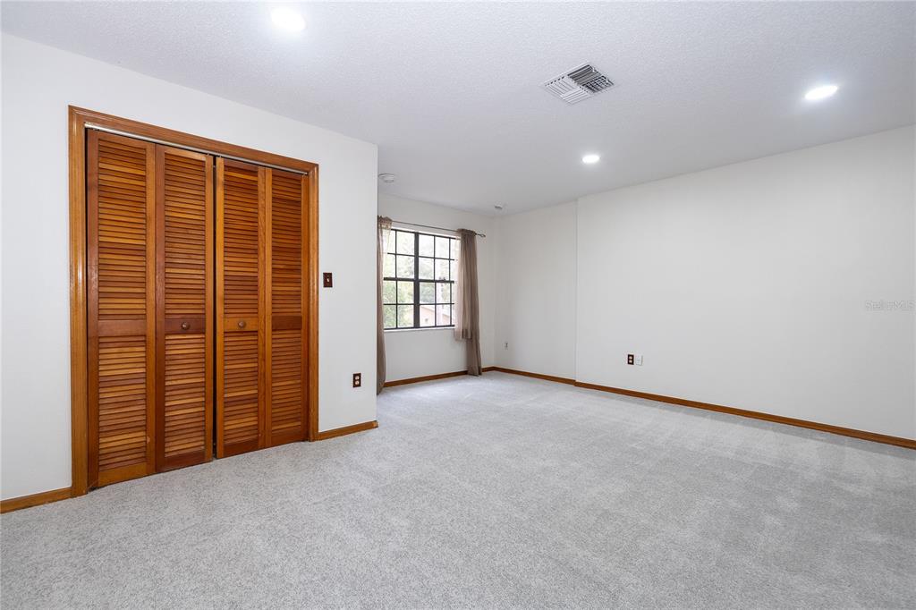 8557 Pilgrim Court New Port Richey, FL 34653 - Photo 26 of 29 an empty room with windows